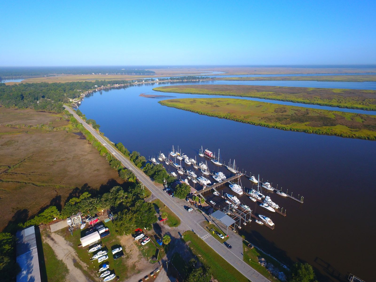 Aerial view of a tidal river, salt marsh and a marina in Bryan County, Georgia