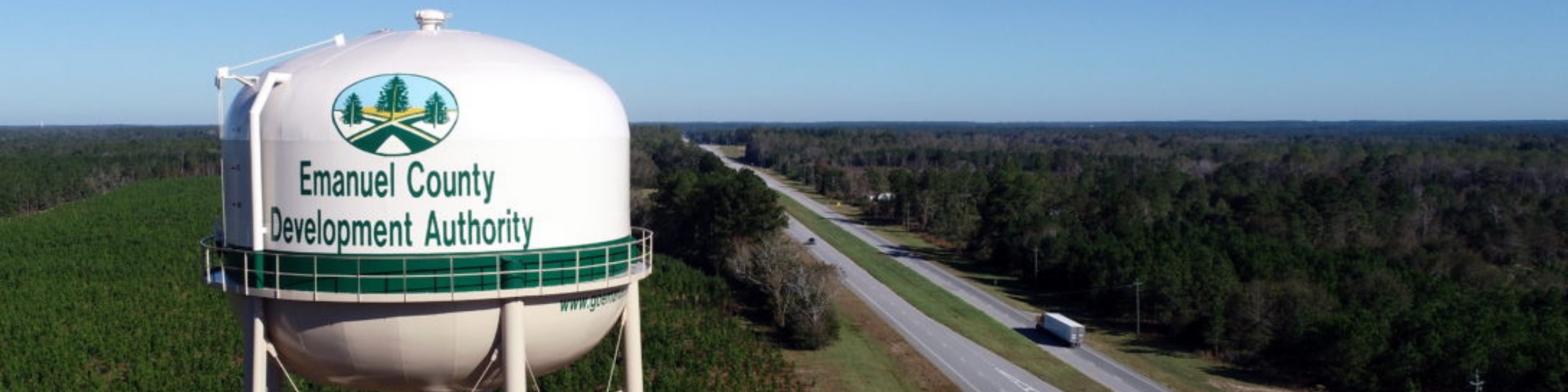 Emanuel County Development Authority water tower above pine forest in Emanuel County, Georgia